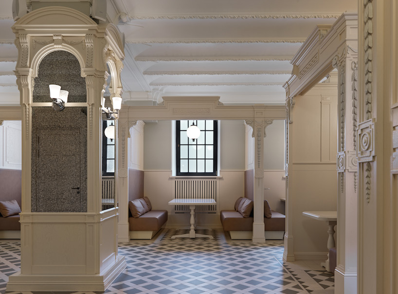 megre interiors renovates 150-year-old historic 'fonarnye bani' in st. petersburg