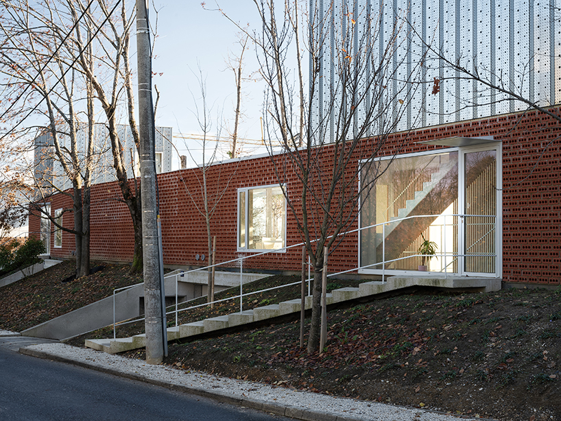 perforated brick facade clads horizontal double villa bukovac by njiric+ arhitekti in zagreb
