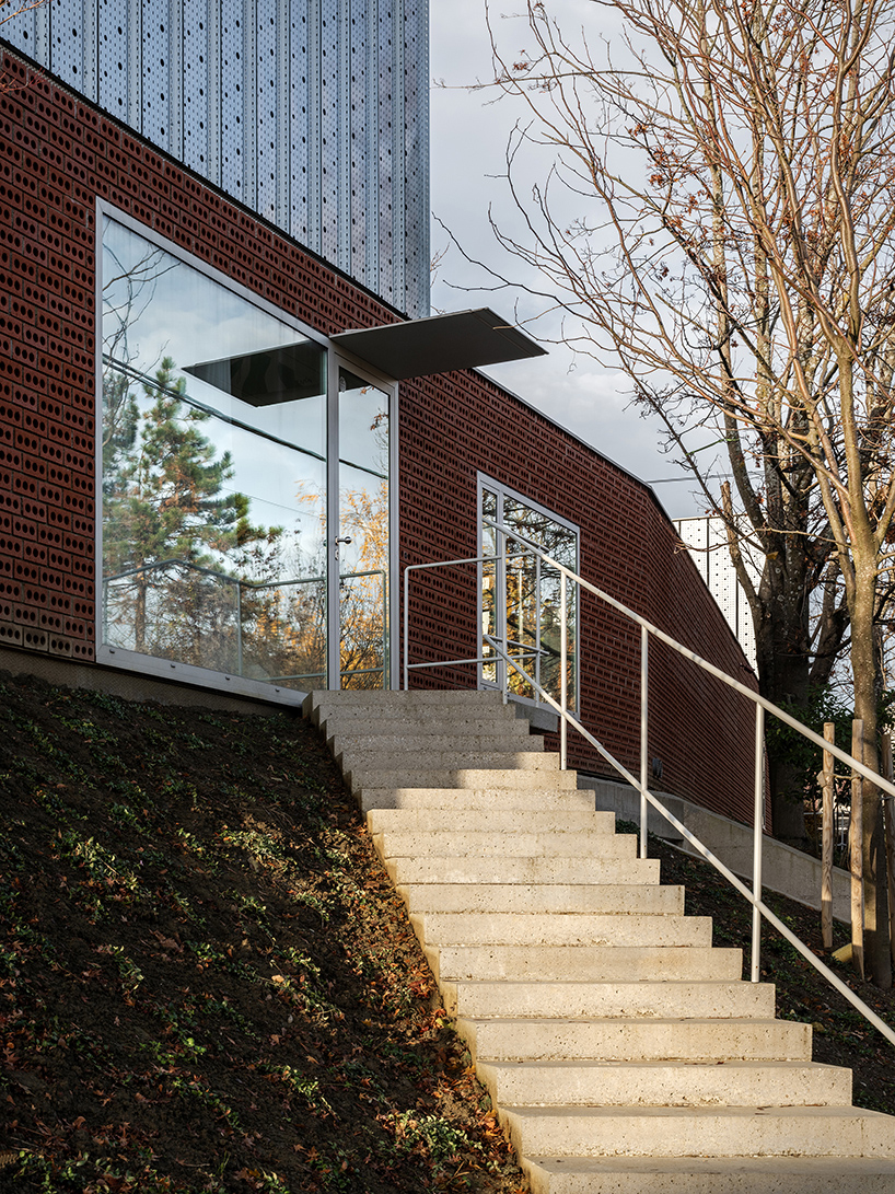 perforated brick facade clads horizontal double villa bukovac by njiric+ arhitekti in zagreb