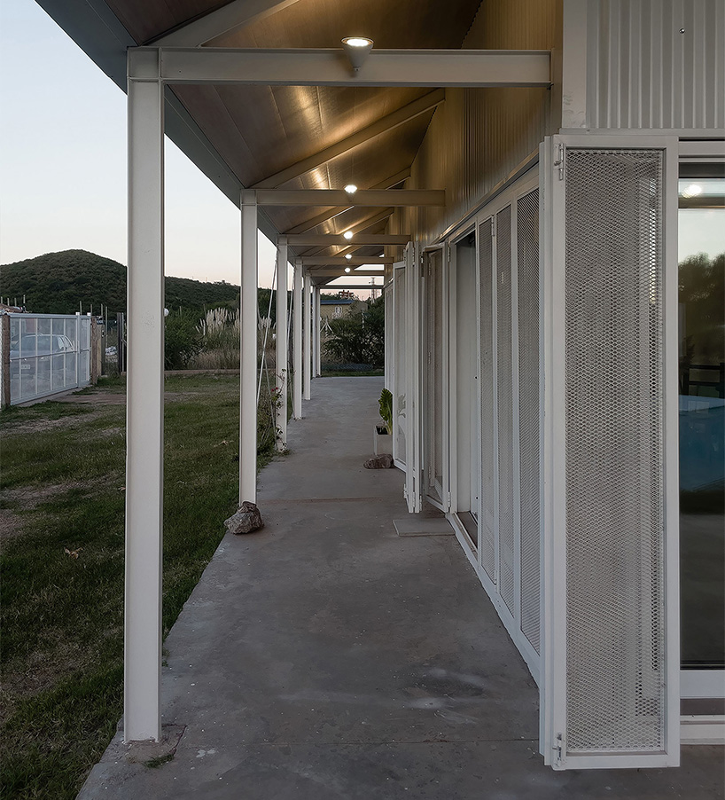 open structural steel grid by estudio BNAA reinterprets barn typology in argentina
