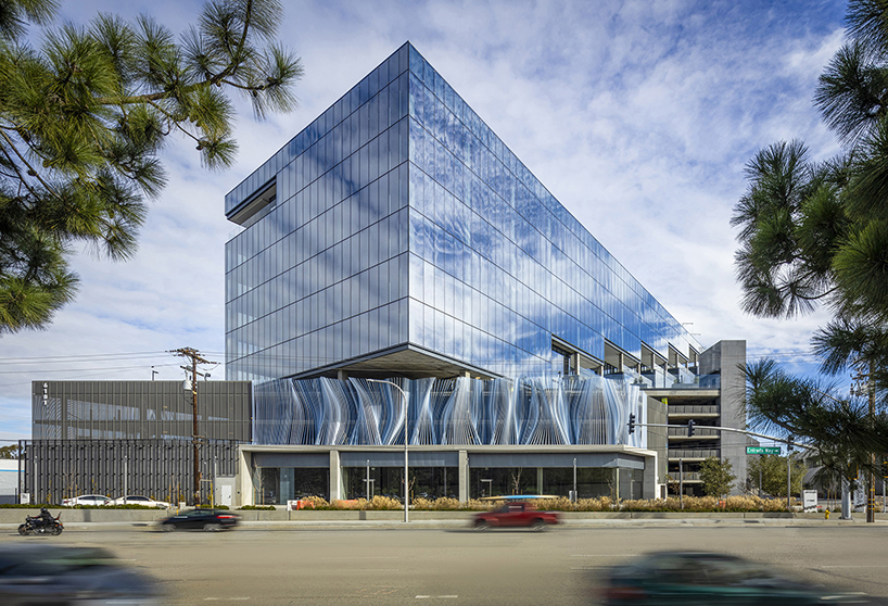 hundreds of aluminum tubes undulate shaping 'ensemble' installation by rob ley