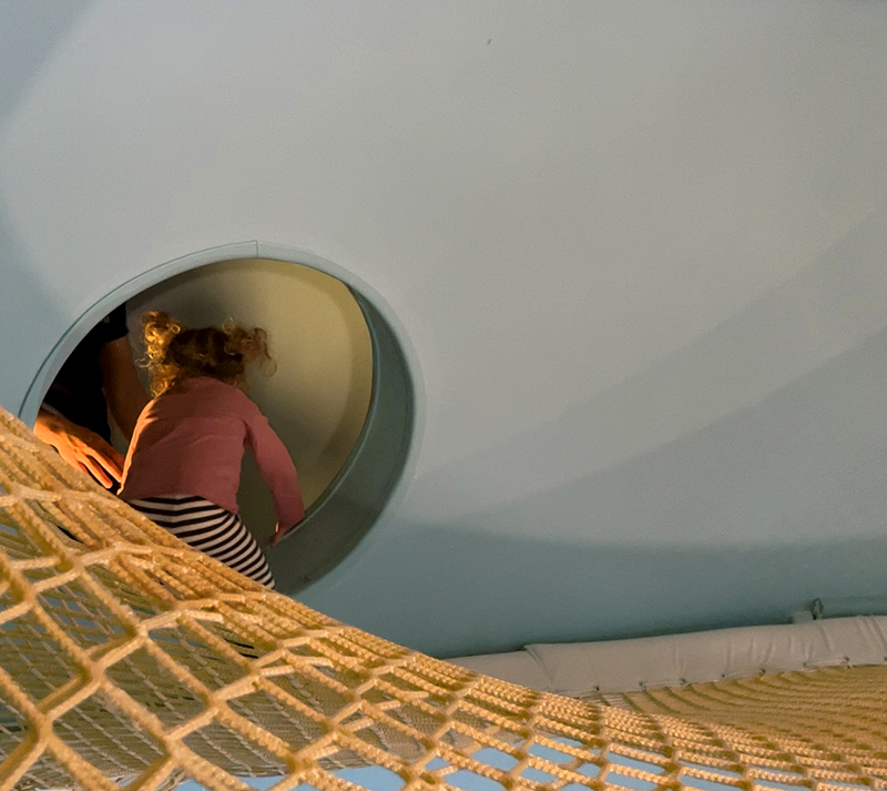 wondersphere entrance leads children to suspended net playground in ...