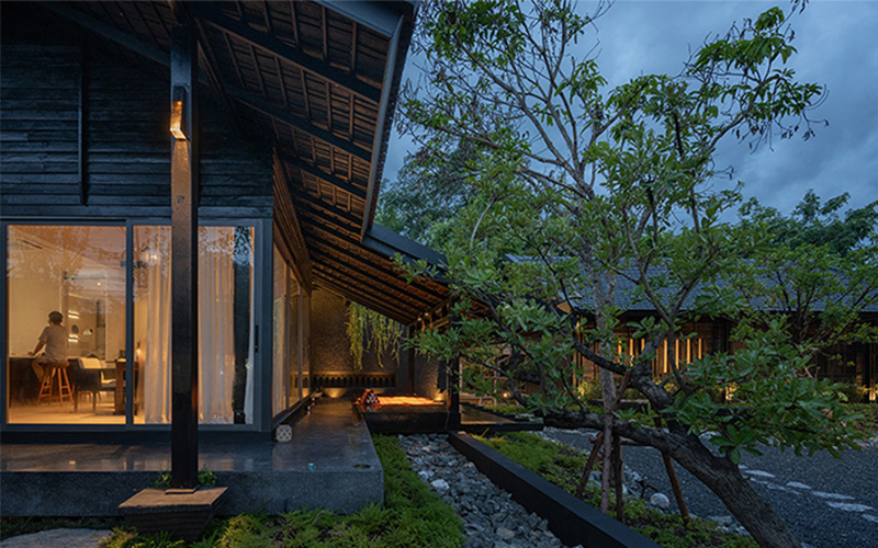 black wooden house in thailand blends contemporary and traditional tectonics