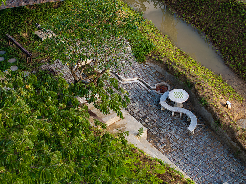 wooden shingles form housescape design lab's organic shelter in thailand