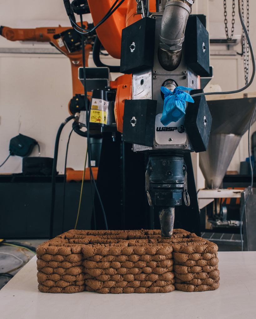 robotically 3d printed earth bricks wrap a multispecies habitat around an olive tree 5