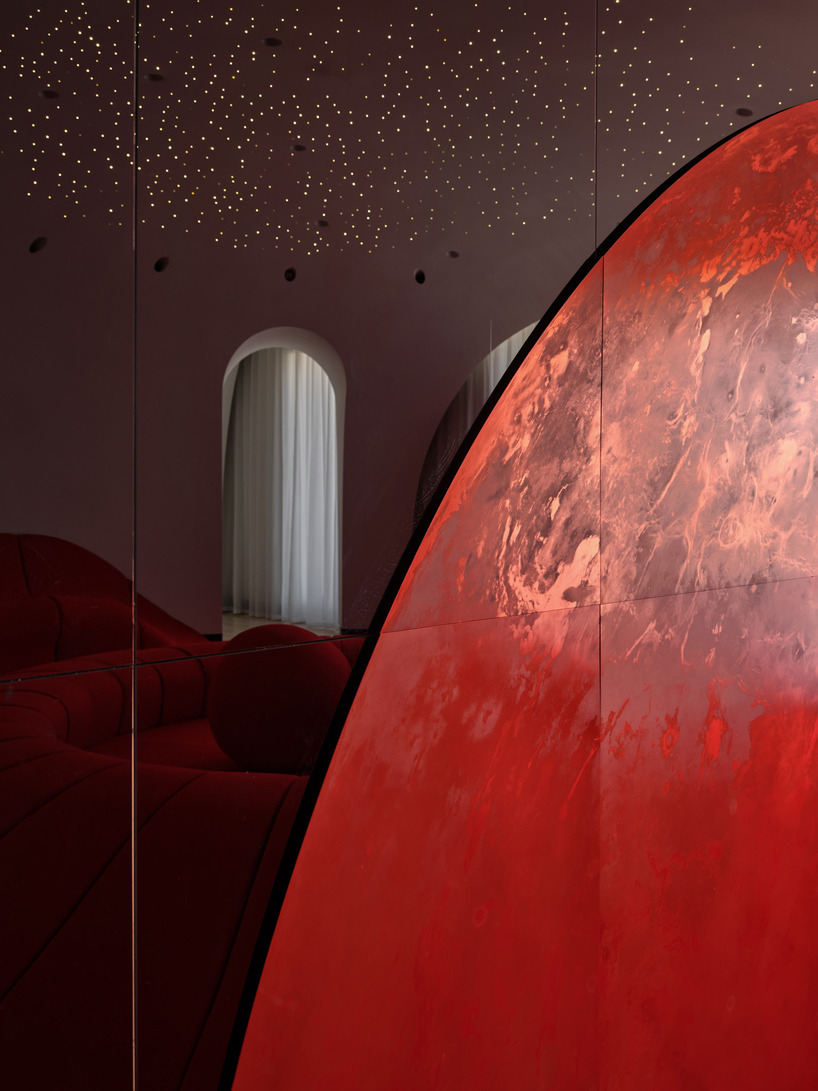 copper planet installation and red undulating seating anchor venus lounge by asap/ in beijing