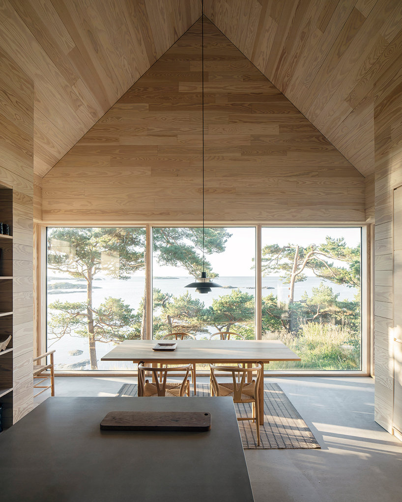 a house made of oak plank offcuts stands on the south coast of norway