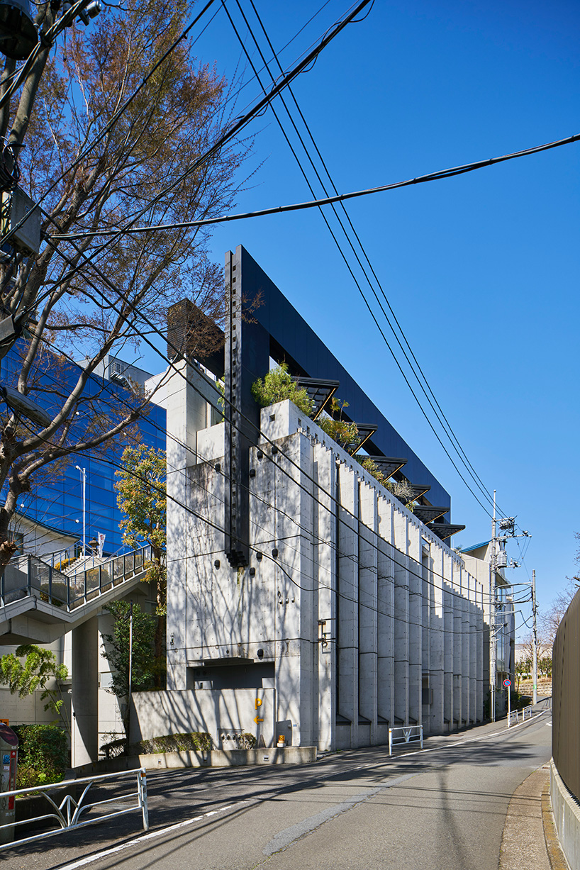 moss. forms patterned concrete facade for design school in tokyo