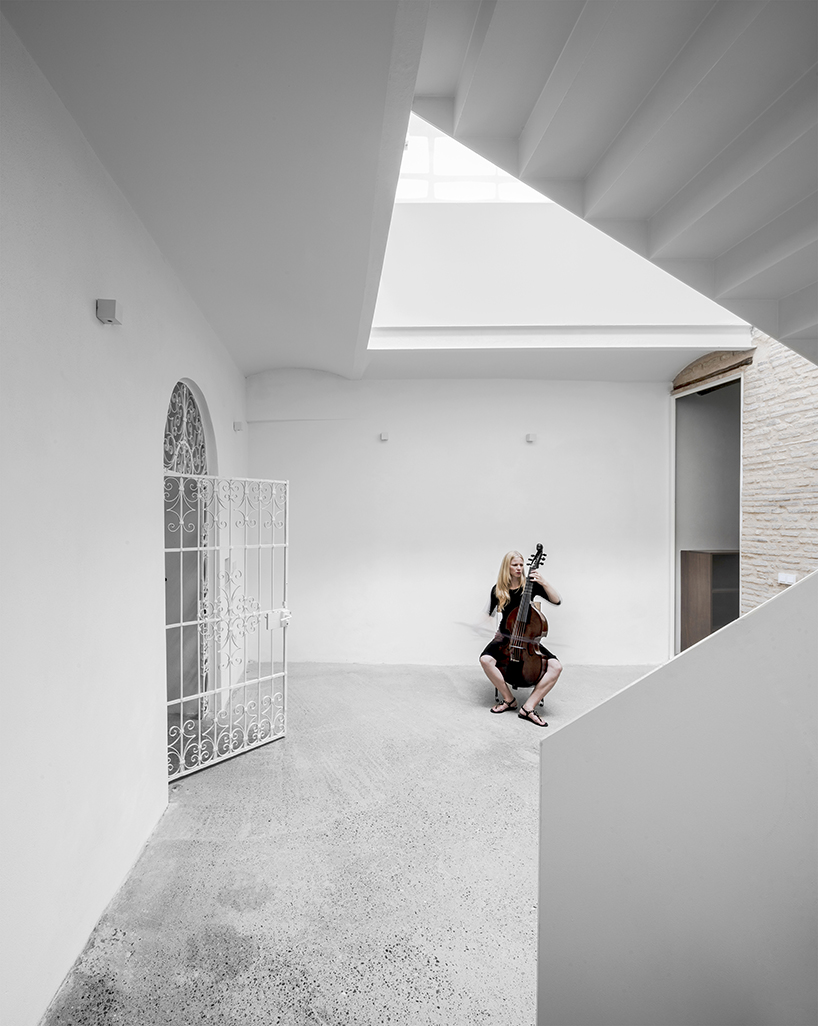 (bau)m transforms 18-century structure into contemporary house for family of musicians in spain