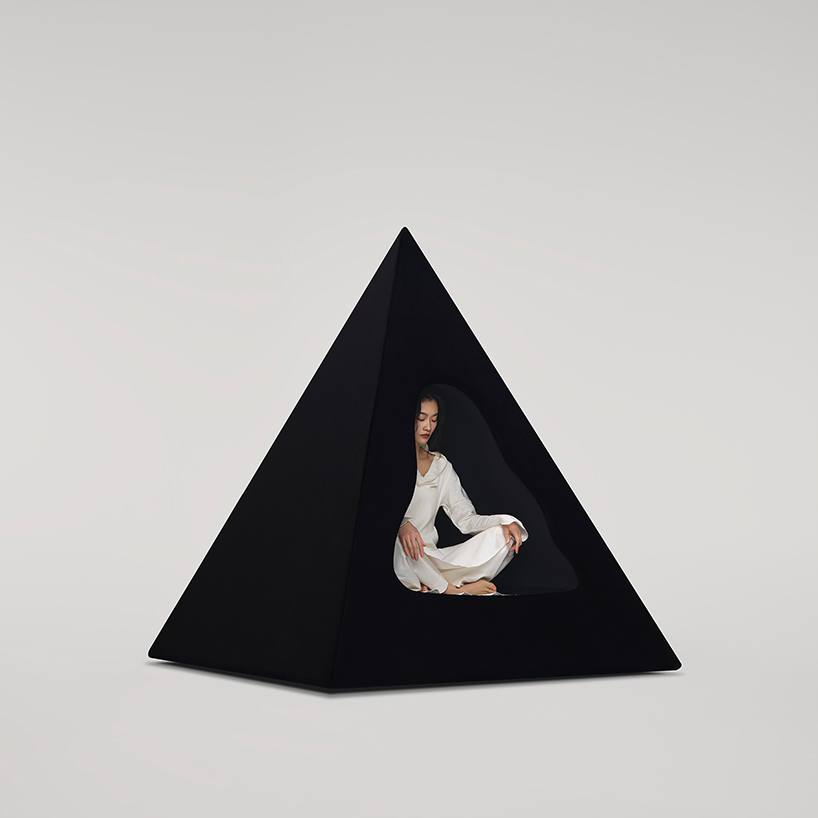 pyramidal cave chair by domain architects for bischiyano shapes retreat for secluded comfort