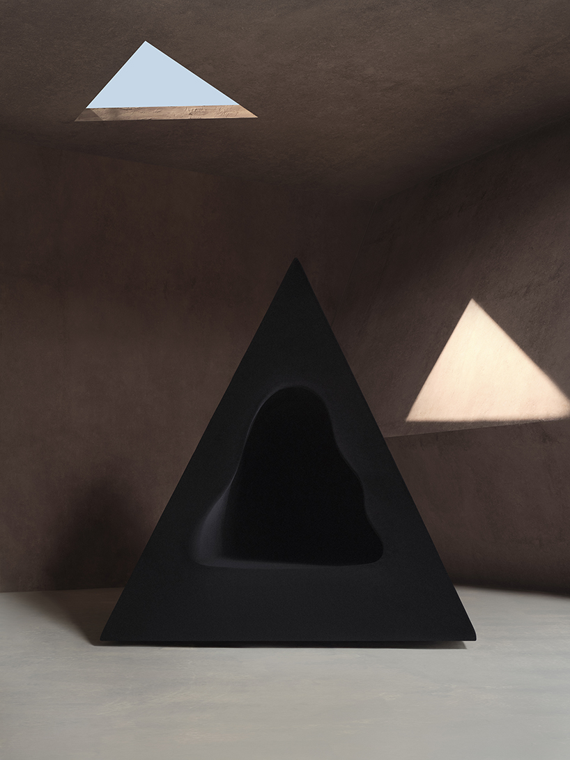 pyramidal cave chair by domain architects for bischiyano shapes retreat for secluded comfort