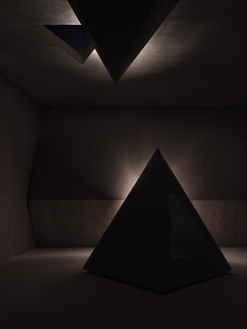 pyramidal cave chair by domain architects for bischiyano shapes retreat for secluded comfort