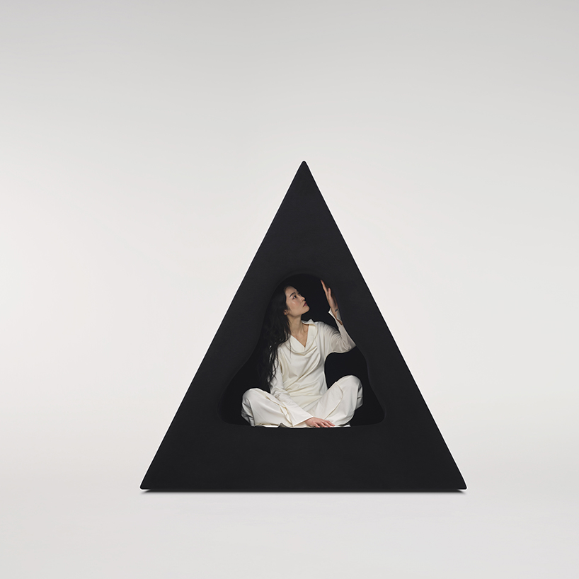 pyramidal cave chair by domain architects for bischiyano shapes retreat for secluded comfort