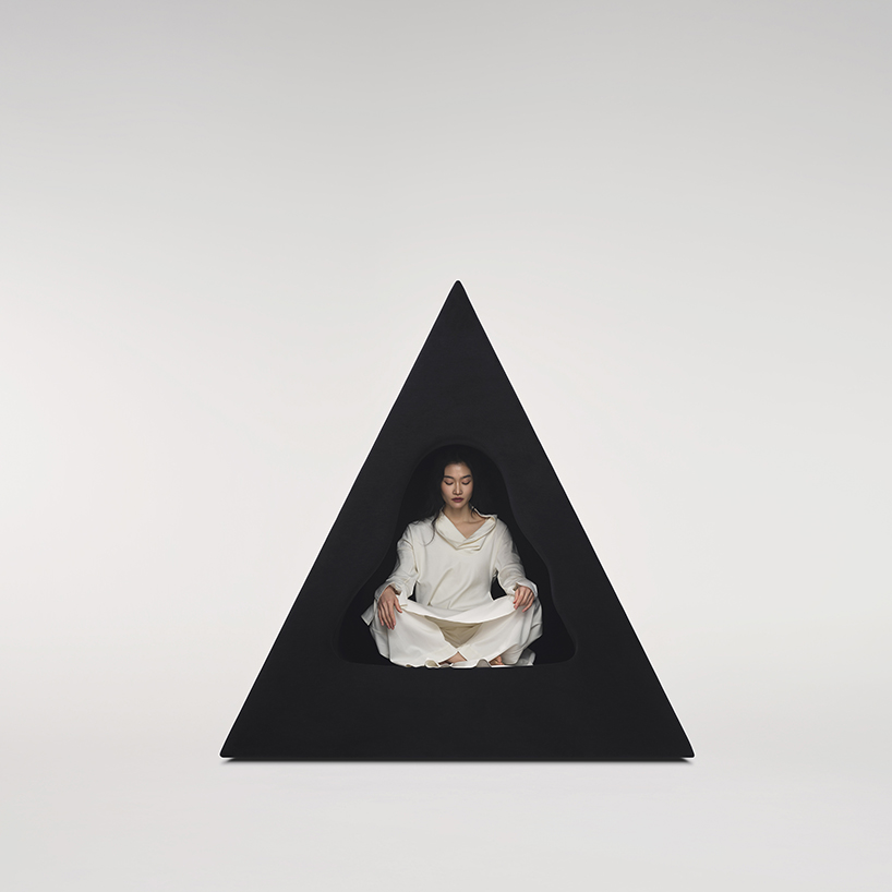 pyramidal cave chair by domain architects for bischiyano shapes retreat for secluded comfort