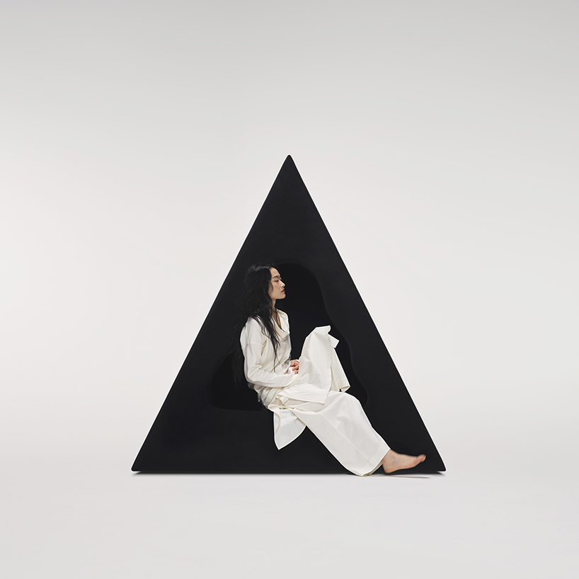 pyramidal cave chair by domain architects for bischiyano shapes retreat for secluded comfort