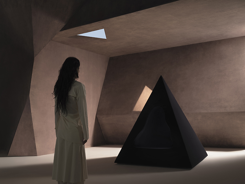 pyramidal cave chair by domain architects for bischiyano shapes retreat for secluded comfort