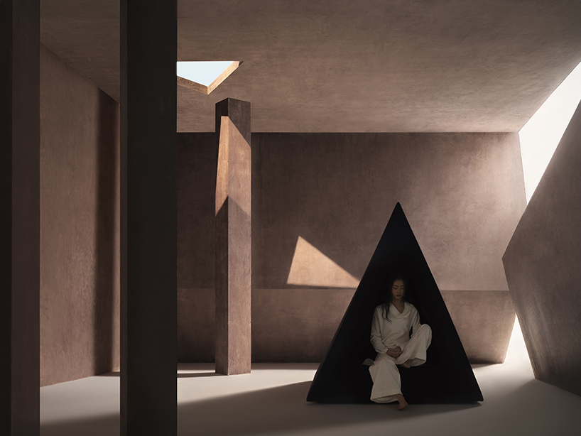 pyramidal cave chair by domain architects for bischiyano shapes retreat for secluded comfort