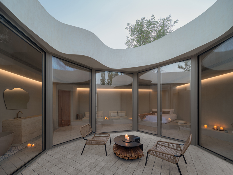 cluster of interwoven white courtyard houses reinterprets ancient kilns for resort in china