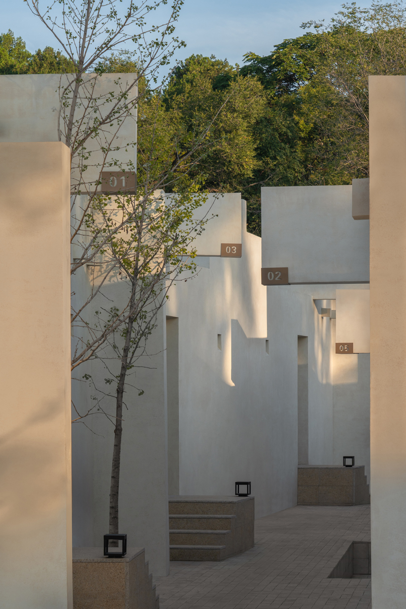 cluster of interwoven white courtyard houses reinterprets ancient kilns for resort in china