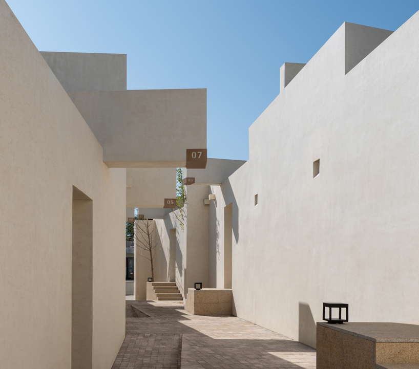 cluster of interwoven white courtyard houses reinterprets ancient kilns for resort in china