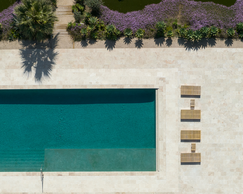 brad walls experiments with negative space & blue hues for 'pools from above' photo series