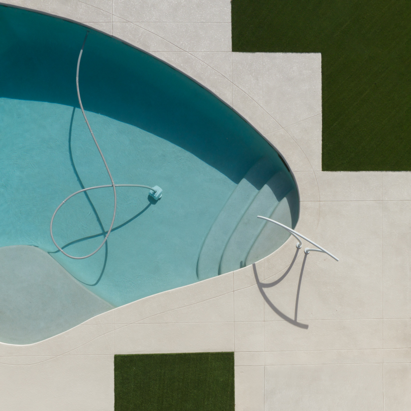 brad walls experiments with negative space & blue hues for 'pools from above' photo series