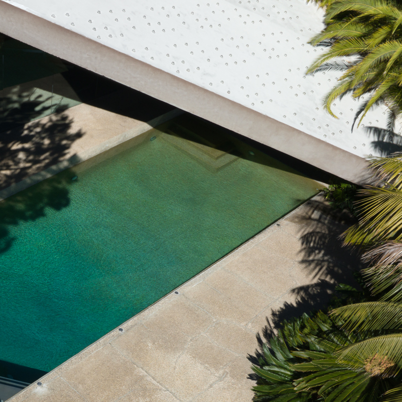 brad walls experiments with negative space & blue hues for 'pools from above' photo series
