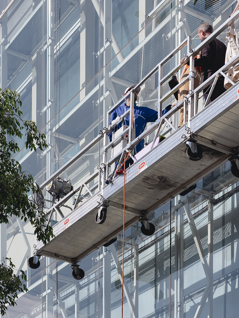 city and architecture are reconciled with installation by maciver-ek chevroulet that perforates messe basel façade