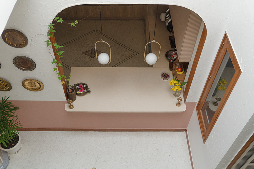 curved balconies clad in brick tiles outline a multi-generational indian home - 10