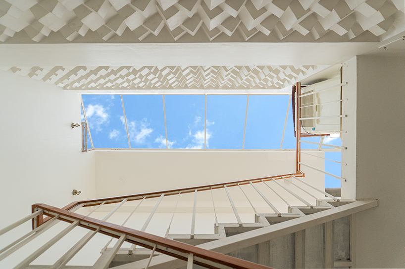 curved balconies clad in brick tiles outline a multi-generational indian home - 5