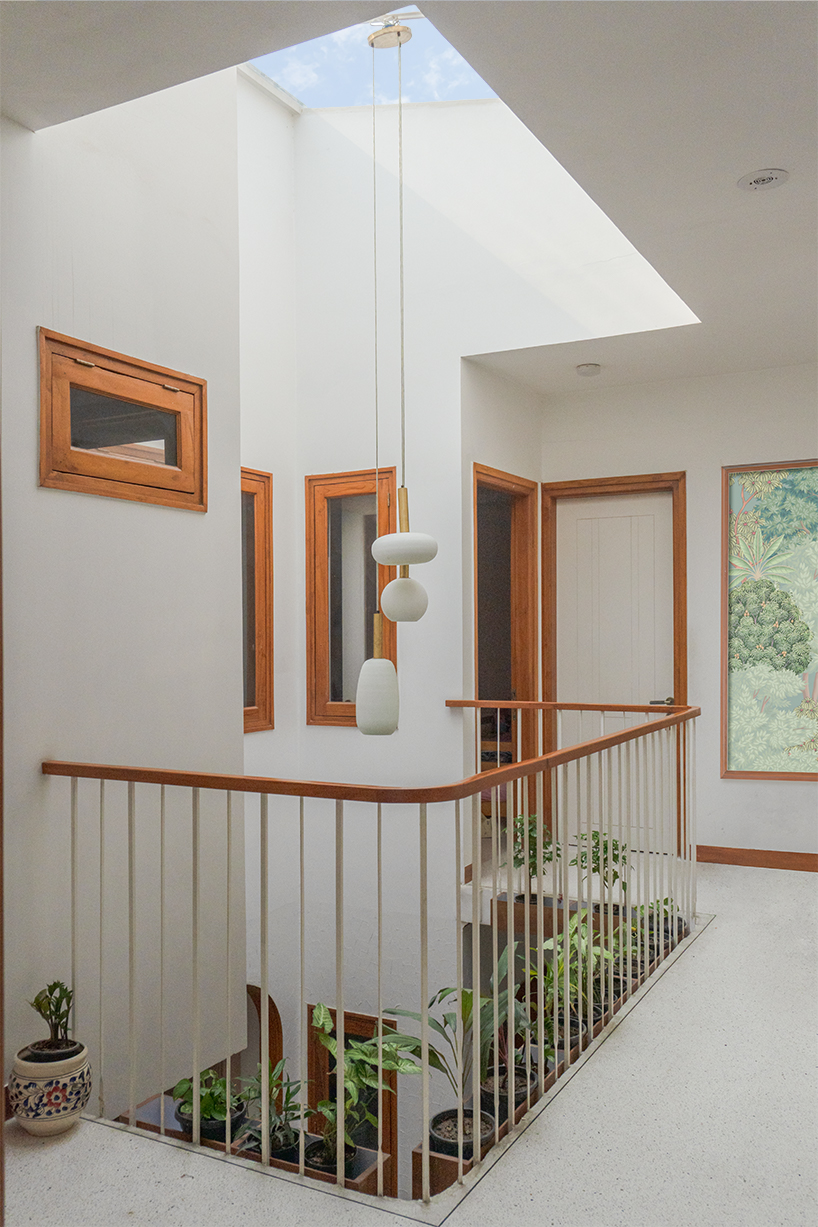 curved balconies clad in brick tiles outline a multi-generational indian home - 7