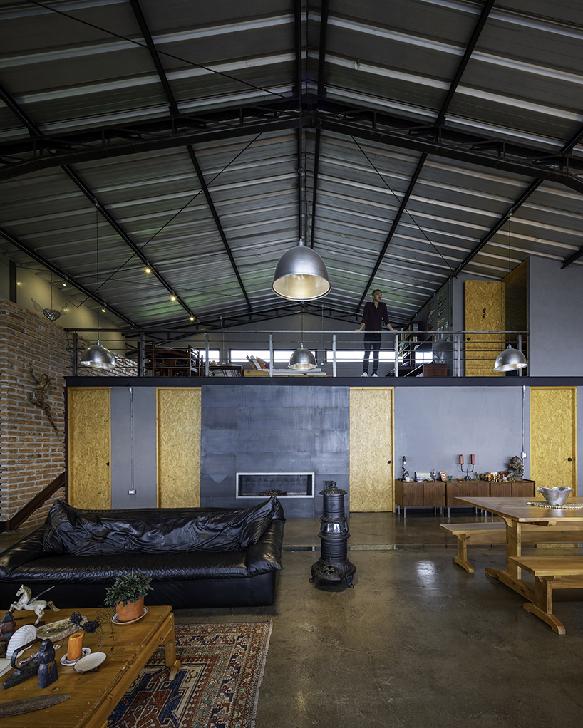 old warehouse is transformed into steel-clad modern country house in ecuador