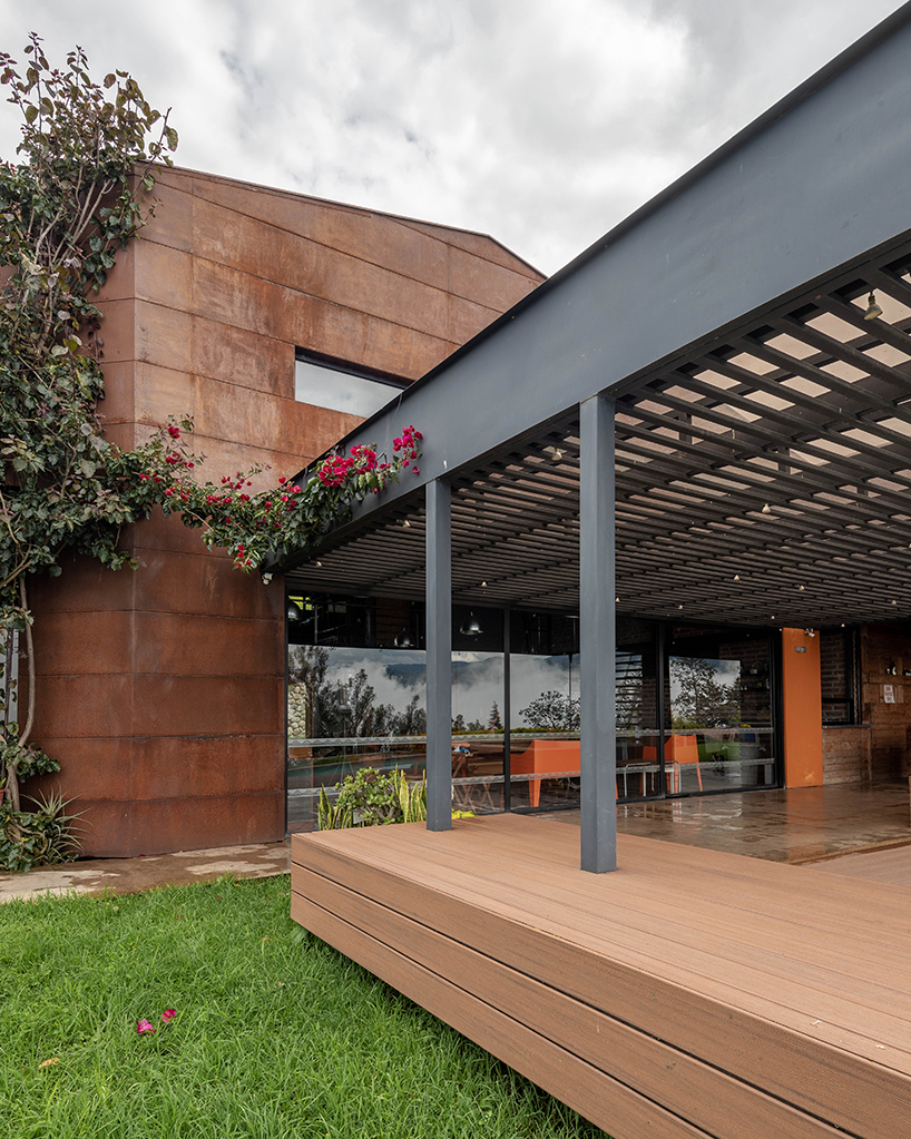 old warehouse is transformed into steel-clad modern country house in ecuador