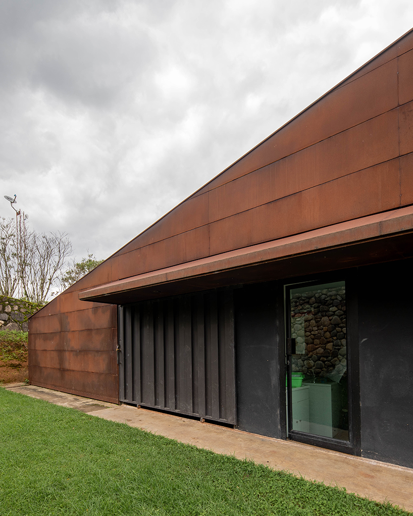 old warehouse is transformed into steel-clad modern country house in ecuador