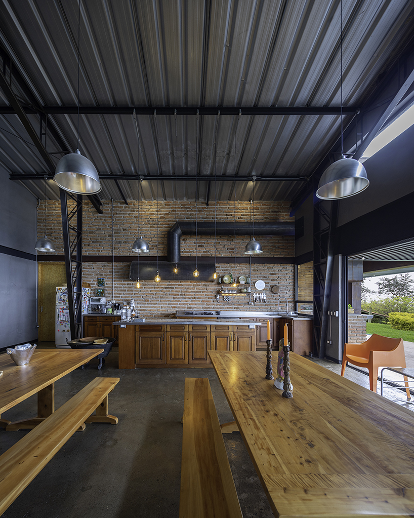 old warehouse is transformed into steel-clad modern country house in ecuador