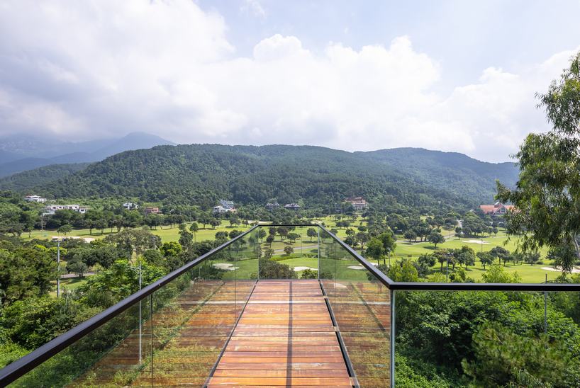 steel frame supports stone-clad ajisai hill house's volumes unfolding in vietnam