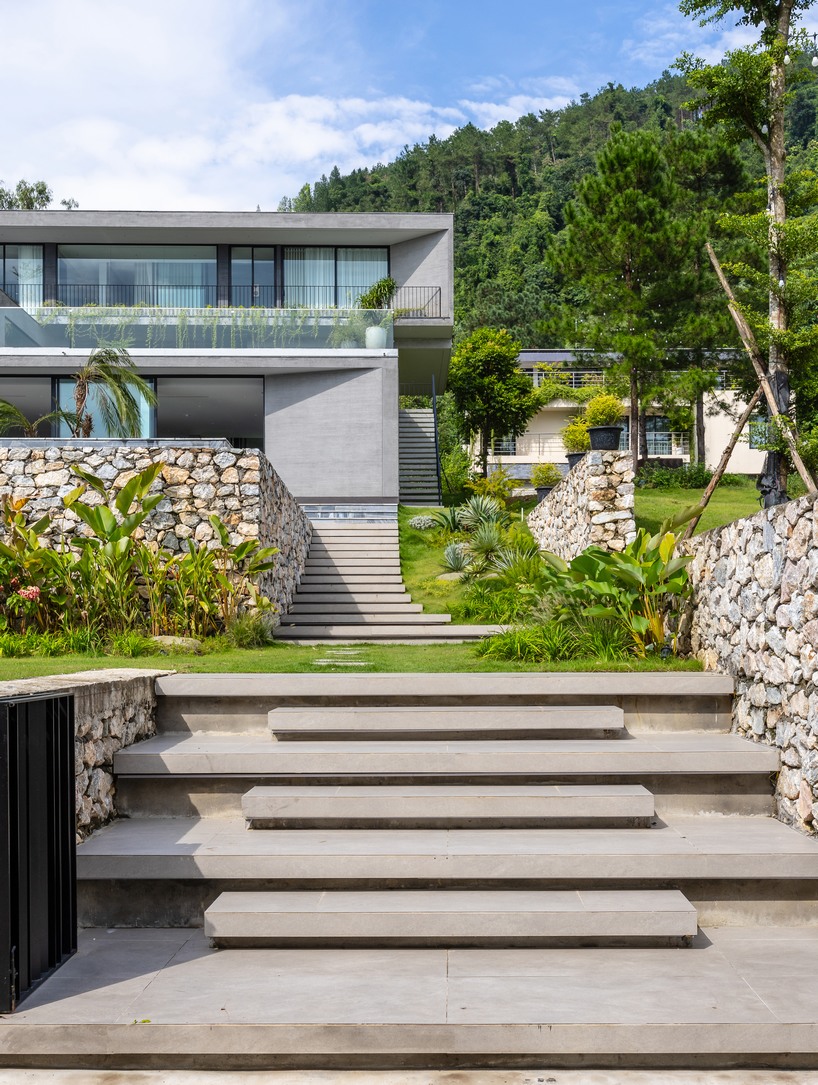 garden courtyards wind through stacked cubes of idee architects' vietnam hillside house