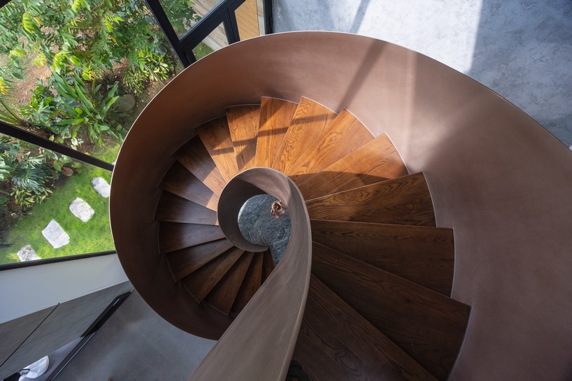 garden courtyards wind through stacked cubes of idee architects' vietnam hillside house