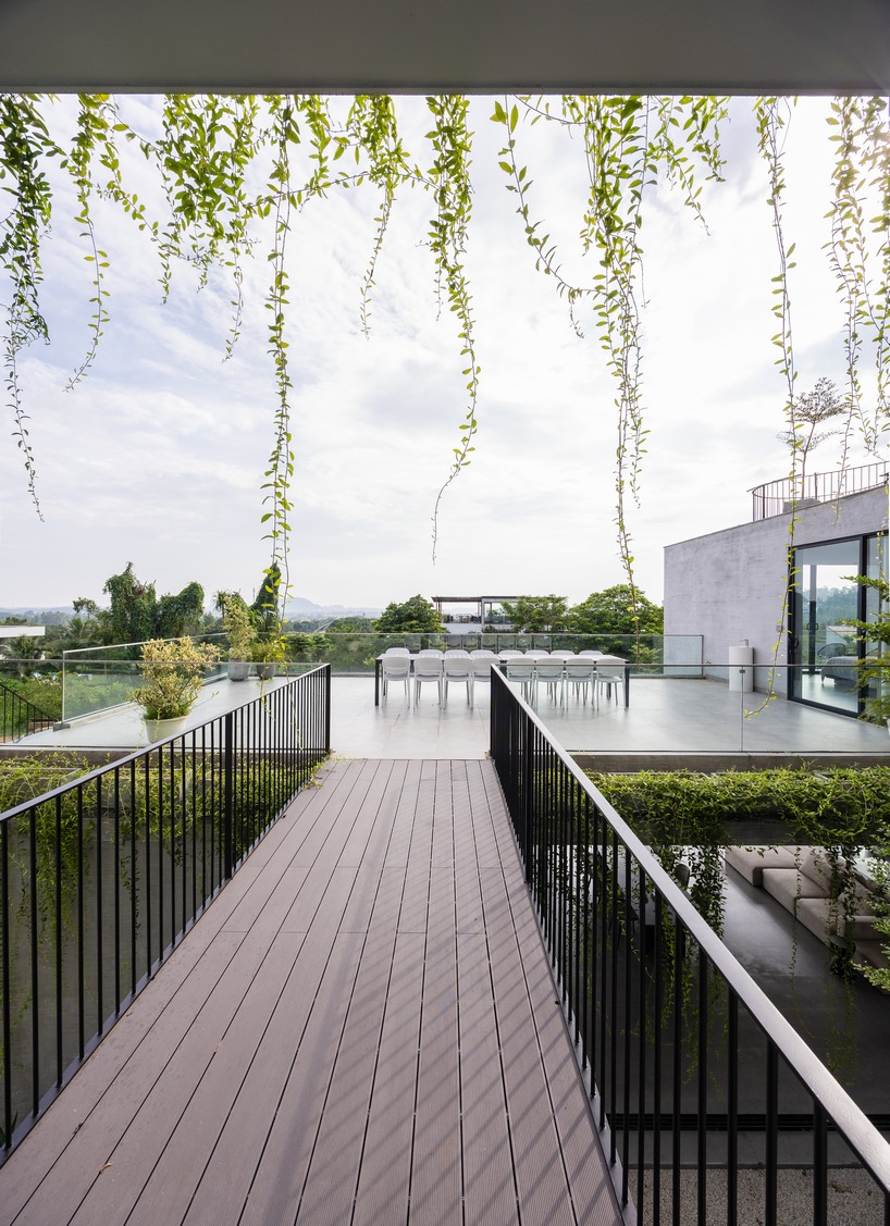 garden courtyards wind through stacked cubes of idee architects' vietnam hillside house