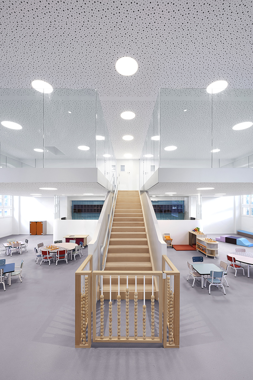 glass-clad mezzanine levels expand renovated nursing school by RMDM in paris