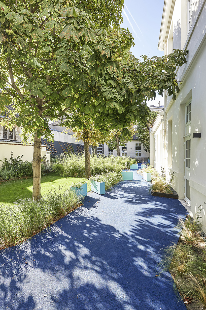 glass-clad mezzanine levels expand renovated nursing school by RMDM in paris