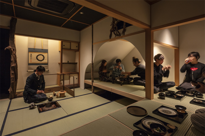 elevated teahouse interior in tokyo morphs traditional japanese- into western-style