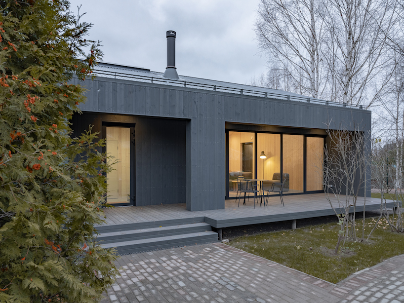 gray softwood boards contour the solid frame of 'delo house 4' in russia