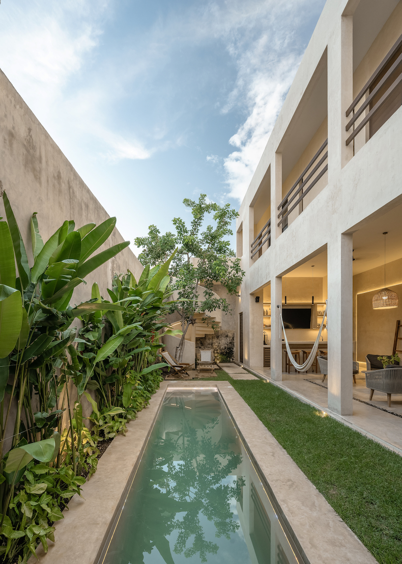 casa verde stands out in bright green facade after renovation by richaud arquitectura