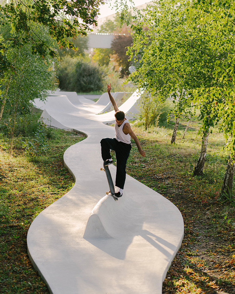 wavy concrete strips stretch along french industrial site to form 'skatepark continua'