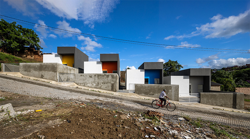clean geometries and bright pops of color characterize social housing by NEBR arquitetura in brazil