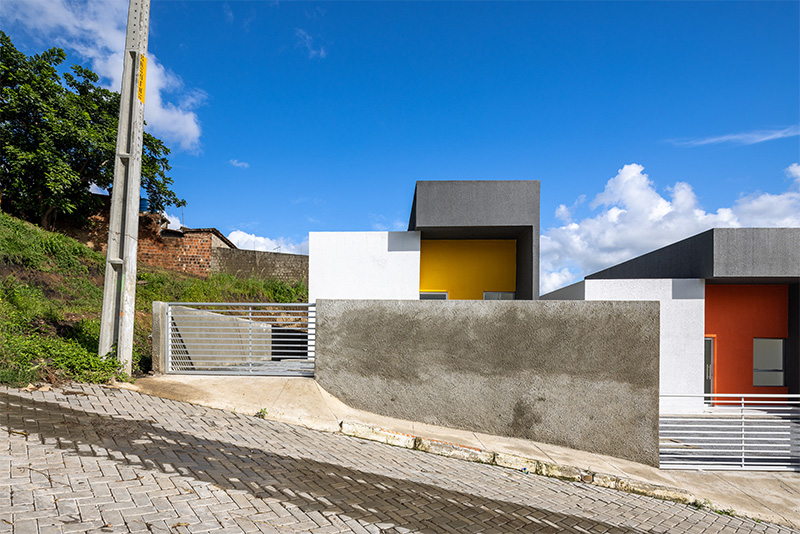 clean geometries and bright pops of color characterize social housing by NEBR arquitetura in brazil