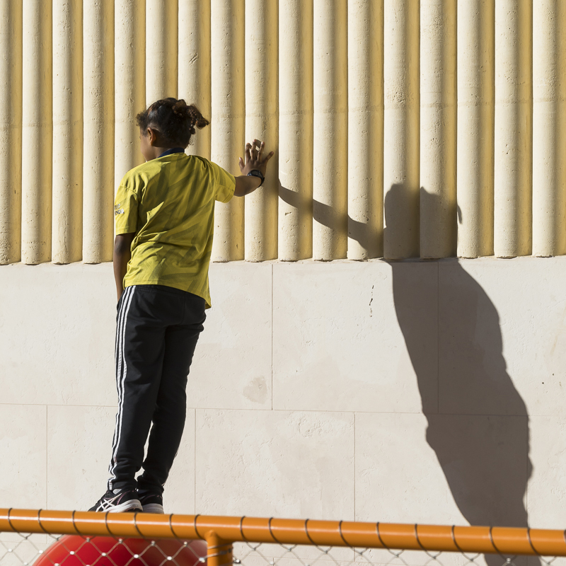 interlocking stone volumes sculpt layered school complex by brenac & gonzalez & associés