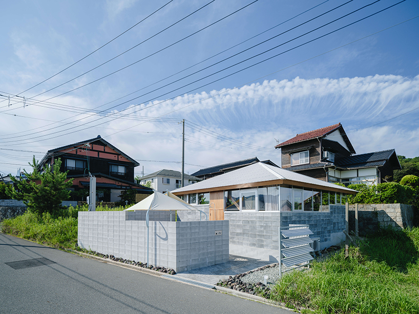 concrete blocks and angled timber beams shape up weekend house in kyoto