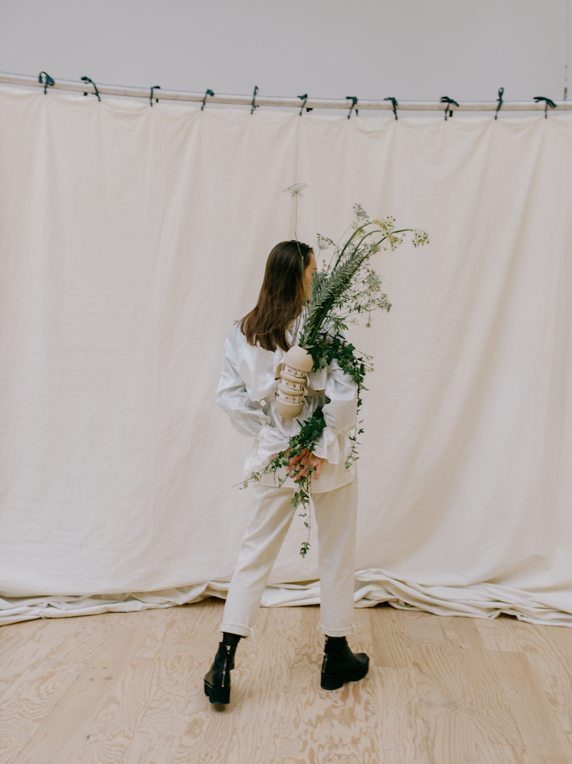 carry your flower bouquets everywhere with this wearable vase by evgeniia kazarezova